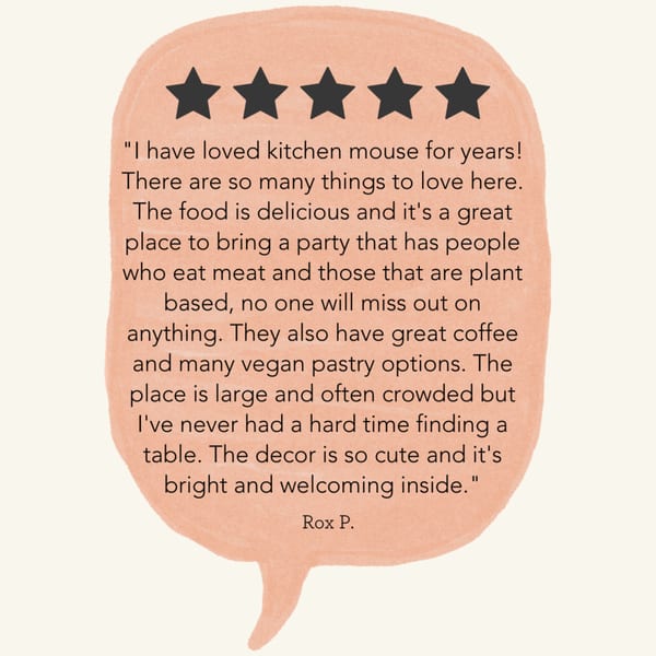 A five-star review for Kitchen Mouse, praising its food, vegan options, and welcoming atmosphere.