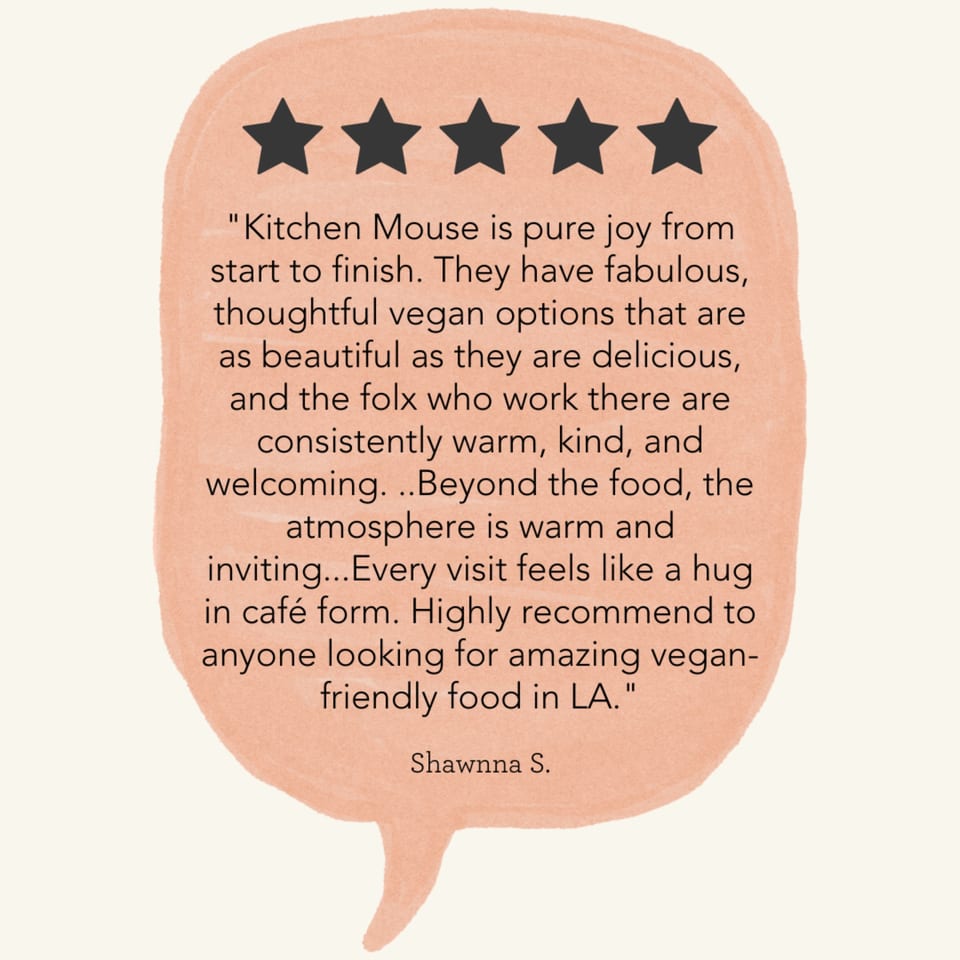 A five-star review for Kitchen Mouse, praising its vegan options, warm staff, and inviting atmosphere.